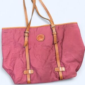 Pink and tan leather tote bag with a touch of glamour